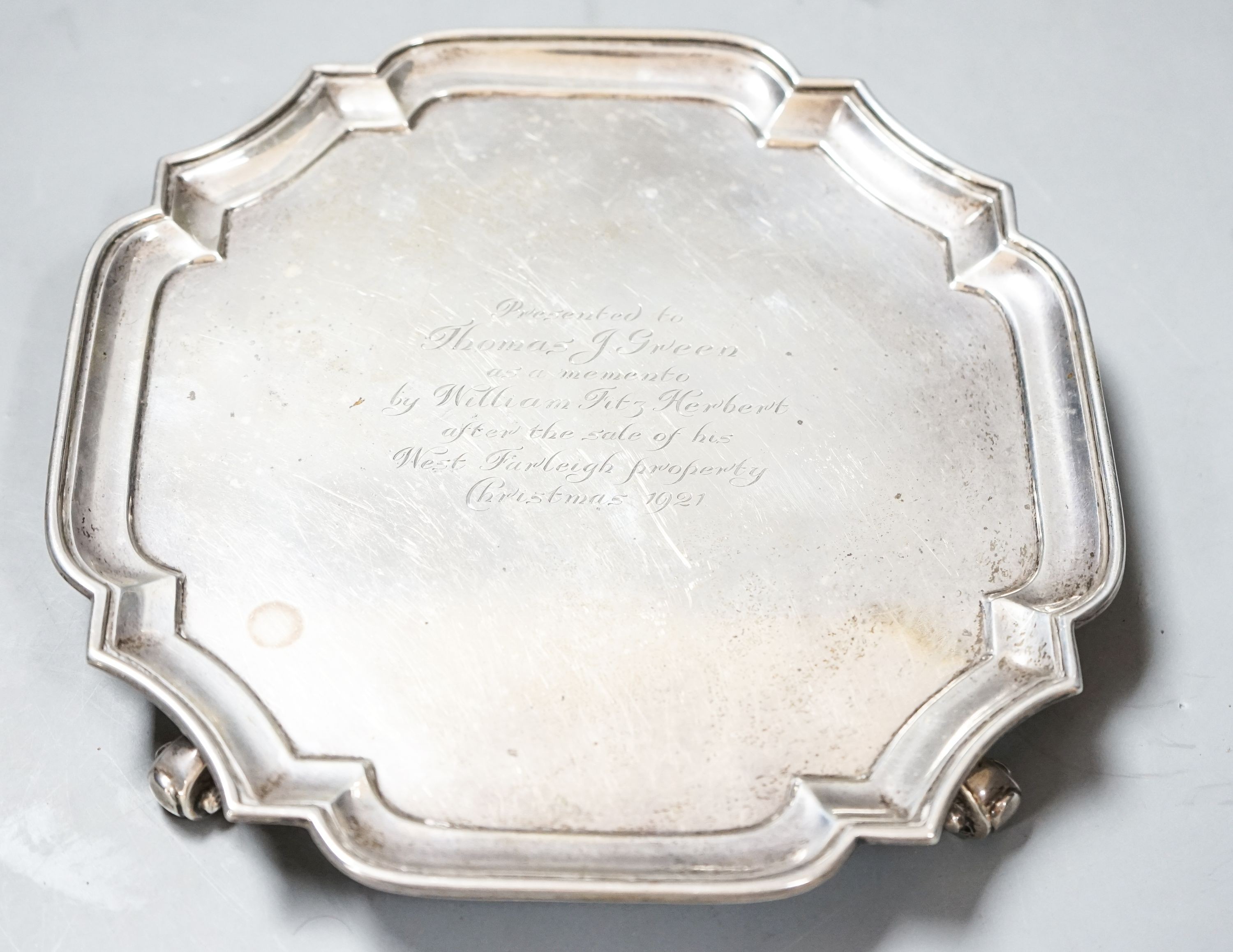 A George V silver shaped square waiter, with engraved inscription, Goldsmiths & Silversmiths Co Ltd, London, 1921, 25cm, 11.5oz.